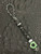 Glow In The Dark Paracord Lanyard with Black Metal Skull, White Turquoise Spacers, Green Glow/Buckeye Burl Infinity Bead