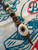 Leather Knife Lanyard with Polished Brass Skull and Hand Carved Elk Antler Infinity Bead Accented by Brass & Tiger's Eye