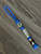 Flamed Metal Shield Cross Lanyard On Royal Paracord with Gray Mini Cord Wrap Accented by Stainless Spacers and Faceted Black Bead
