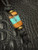 Crushed Turquoise & Stabilized Marble Wood Bead with Hand Sculpting on Black 550 Cord Accented by Brass Ring Spacers