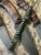 Tactical Series Black & OD Green Layered G10 Hand Sculpted Bead Knife Lanyard on Jungle Camo Paracord Accented by OD Green Mini Cord, Hematite, and Bras Spacers