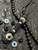Black 550 Paracord Knife Lanyard with Mother of Pearl Infinity Bead Accented by Onyx and Stainless Spacers