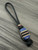 Custom Split Bead Knife Nub with Black Carbon Fiber, Dyed Blue Burl, Tan G10, Black G10, and Copper Accented by Onyx and Copper Spacers On Black 550 Cord