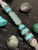 Premium Collection Silver Carbon Fiber & Gold Web Turquoise Tru-Stone Knife Lanyard with Gray and Turquoise Cobra Wrap Accented by Turquoise and Brass