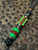Black 550 Cord Knife Lanyard with Dyed Gray Curly Maple, Green Griptec, and Amboyna Burl Split Bead Accented by Copper, Hematite, and Two Tone Mini Cord Cobra Wrap