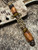 Sculpted Amboyna Burl Wood Bead Knife Lanyard On Fall Camo Paracord with FDE Cobra Wrap, Tiger's Eye Spacers, and Copper Rings