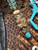 Custom Sculpted Richlite Micarta Bead with Turquoise Blue and White Liners on Matching Camo 550 Cord Accented by Brass Winged Helmet and Two-Tone Mini Cord Cobra Wrap