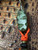 Dyed "Swamp Green" Curly Maple, Orange G10 and Black G10 Handle Bottle Opener with Matching Wood, Orange Glow, G10, and Black Micarta Bead Lanyard