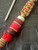 Stabilized Burl, Coyote G10, and Pink Resin Split Bead Knife Lanyard On Red 550 Cord with Coyote Wrap Accent