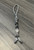 Gray and Black Paracord Knife Lanyard with Pirate Skull Bead, Accents, and Glow Skulls Gray and Black Paracord Knife Lanyard with Pirate Skull Bead, Accents, and Glow Skulls