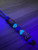 Royal Blue Paracord Knife Lanyard with Blue Glow In The Dark Spacers, Maple Burl & Multi-Color Resin Split Bead, and Silver Finished Native Skull Bead Royal Blue Paracord Knife Lanyard with Blue Glow In The Dark Spacers, Maple Burl & Multi-Color Resin Split Bead, and Silver Finished Native Skull Bead