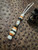 Custom Split Bead Knife Lanyard with Gold Web Tru-Stone, Koa Wood, Ebony, and Brass Spacers on White with Black Spec Paracord