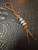 Leather Shorty Knife Nub with Amboyna Burl, Gold Web Tru-Stone, and Ironwood Split Bead Accented by Turquoise & Brass Leather Shorty Knife Nub with Amboyna Burl, Gold Web Tru-Stone, and Ironwood Split Bead Accented by Turquoise & Brass
