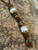 Teak and Gold Web Tru-Stone Split Bead Knife lanyard with Brass and Tiger's Eye Accents on Leather Teak and Gold Web Tru-Stone Split Bead Knife lanyard with Brass and Tiger's Eye Accents on Leather