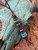 Brown Rope Leather Knife Lanyard with Handmade Ironwood and Black Web Turquoise Tru-Stone Split Beads Accented by Hematite Spacers Brown Rope Leather Knife Lanyard with Handmade Ironwood and Black Web Turquoise Tru-Stone Split Beads Accented by Hematite Spacers