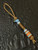 Light Blue Patina Brass Eagle Head Knife Lanyard with Amboyna Burl and Larimar Tru-Stone Split Bead Accented by Brass and Opalite Spacers Light Blue Patina Brass Eagle Head Knife Lanyard with Amboyna Burl and Larimar Tru-Stone Split Bead Accented by Brass and Opalite Spacers