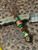 Rustic Brown Lace Leather Knife Lanyard with Handcrafted Wood Layer Bead, Malachite Spacers, and Brass Pirate Skull