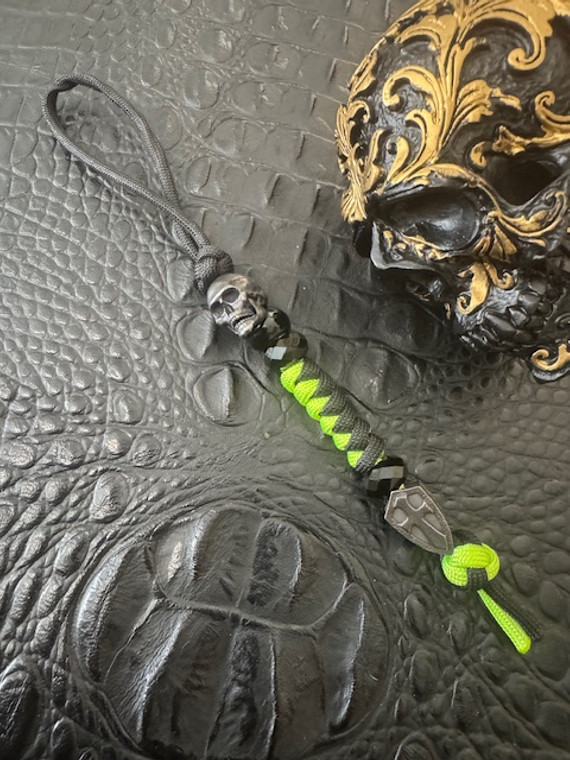 High Visibility Neon Green and Black Two-Tone Paracord Knife Lanyard with Black Metal EDC Skull and Cross Shield Beads
