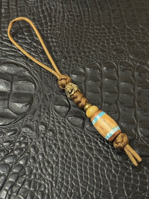 Coyote Brown Paracord Knife Lanyard with Brass Lion Head and Handmade Larimar, Teak, and Aged Antler Split Bead