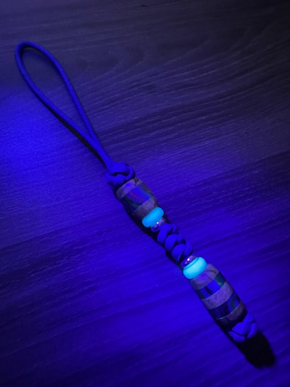 Royal Blue Paracord Knife Lanyard with Blue Glow In The Dark Spacers & Maple Burl and Multi-Color Swirl Resin Split Beads Royal Blue Paracord Knife Lanyard with Blue Glow In The Dark Spacers & Maple Burl and Multi-Color Swirl Resin Split Beads