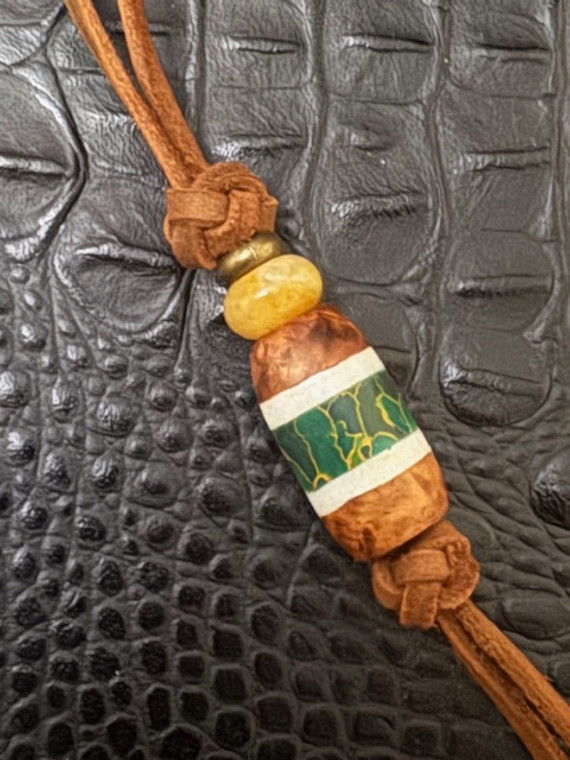 Leather Shorty Knife Nub with Amboyna Burl, Elk Antler, and Arizona Jade Tru-Stone Split Bead Accented by Yellow Jade and Brass Leather Shorty Knife Nub with Amboyna Burl, Elk Antler, and Arizona Jade Tru-Stone Split Bead Accented by Yellow Jade and Brass