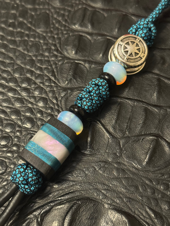 Stainless Steel Compass Bead Knife Lanyard On Turquoise-Black Paracord with Opalite Accents and Dyed Curly Maple, Ebony Wood, and Mother of Pearl Resin Handmade Bead