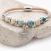 Sterling silver starfish cork bracelet with ceramic beads styled on a coastal stone — 7 inch handcrafted Florida artisan jewelry — Crabby Mermaid