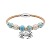 Cork bracelet with blue and cream ceramic beads and sterling silver crab charm on white background — Crabby Mermaid