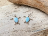 Close-up of genuine Larimar sea turtle drop earrings in .925 sterling silver — French wire hooks — Crabby Mermaid