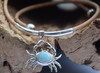 Larimar crab necklace on cork with 4x20mm sterling silver tube accents displayed on driftwood — Crabby Mermaid