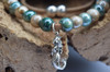 Sterling Silver Mermaid Necklace with green and beige beads on cork