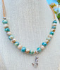 Full view of sterling silver mermaid cork necklace with coastal ceramic beads in ocean teal and sandy beige — Crabby Mermaid