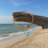 Larimar turtle necklace on cork cord hanging from driftwood on the beach - Crabby Mermaid