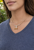 Woman wearing Koa wood whale tail necklace on cork cord — styled coastal beach jewelry — Crabby Mermaid