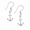 Sterling silver anchor dangle earring worn on model at beach — French wire hook nautical coastal jewelry