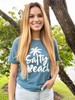 Salty Beach Short Sleeve Graphic Tee - Teal

Our Salty Beach short sleeve graphic women's tee is made from a lightweight cotton/polyester blend that's soft against the skin while keeping you comfortable all day. In addition, this fun and fashionable tee is made with a loose cut to give you a comfortable feel. Our teal Salty Beach tee, fits like a well-loved favorite, featuring a crew neck and short sleeves and designed with superior combed and ring-spun cotton. A must-have item. Pair this graphic Salty Beach tee shirt for women with jeans, cropped pants, or shorts. Or create a dressy style with a cute skirt and low heels.

52% Cotton, 48% Polyester