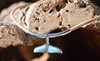 Larimar whale tail pendant close-up showing genuine Caribbean blue Larimar set in sterling silver — Florida artisan jewelry