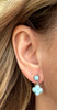 Larimar clover flower drop earring worn on model — round Larimar stud top with clover pendant drop — .925 sterling silver — Crabby Mermaid