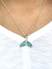 Larimar whale tail necklace worn on model showing pendant size and chain — genuine Dominican Republic Larimar — Crabby Mermaid