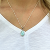 Larimar teardrop necklace worn on model showing pendant size and chain — genuine Dominican Republic Larimar — Crabby Mermaid