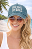 Model wearing Good Times Tan Lines light blue baseball cap - coastal lifestyle hat