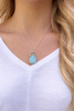 Larimar octopus necklace worn on model showing pendant size and chain length — hand assembled by Crabby Mermaid