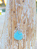 Larimar octopus necklace on sterling silver chain displayed on driftwood — genuine Dominican Republic Larimar — Crabby Mermaid