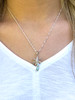 Natural Larimar Palm Tree .925 Sterling Silver Necklace - 18"

Dreaming of relaxing on the beach, cold drink in hand, under a coconut tree? This beautiful piece is sure to remind you the beach is calling. This gorgeous necklace is crafted of highly polished sterling silver and set with a stunning blue Larimar gemstone.