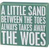 A little Sand Between the Toes Wood Sign

A wooden box sign featuring a beachy green background with distressed "A Little Sand Between The Toes Always Takes Away The Woes" sentiment. Easy to hang or can free-stand alone.