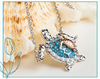 Two-tone mother and baby sea turtle pendant necklace with aquamarine crystals - sterling silver mom turtle with rose gold baby - handcrafted in Ireland - Crabby Mermaid