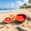 Citrus coconut shell candle with fresh cut grapefruit on tropical beach — soy coconut wax candle — Crabby Mermaid