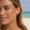 Gold plated Larimar and cubic zirconia drop earrings worn on model at Florida Gulf Coast beach - Crabby Mermaid