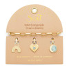 Interchangeable charm bracelet blue howlite harmony gold on packaging card showing all three charms — rainbow, sunburst heart, crescent moon — Crabby Mermaid