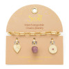 Interchangeable charm bracelet tourmaline healing gold on packaging card showing all three charms — engraved heart, raw tourmaline stone, sunburst circle — Crabby Mermaid